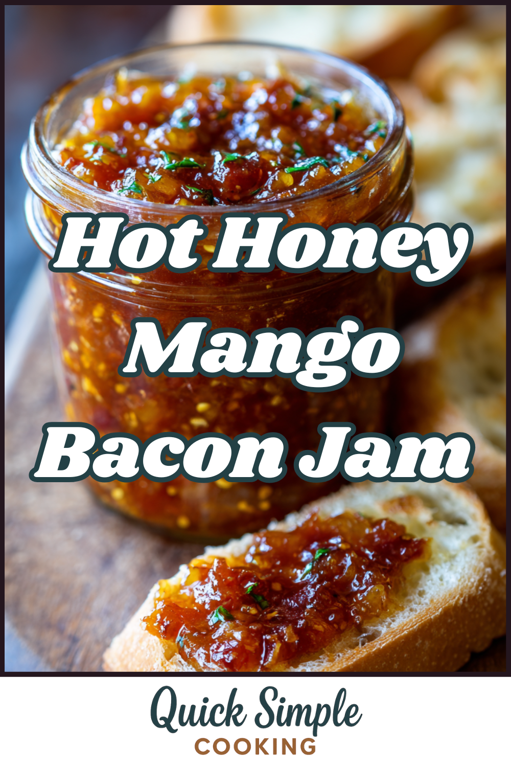 A jar of Hot Honey Mango Bacon Jam sits next to pieces of toasted bread topped with the spicy-sweet jam on a wooden surface.